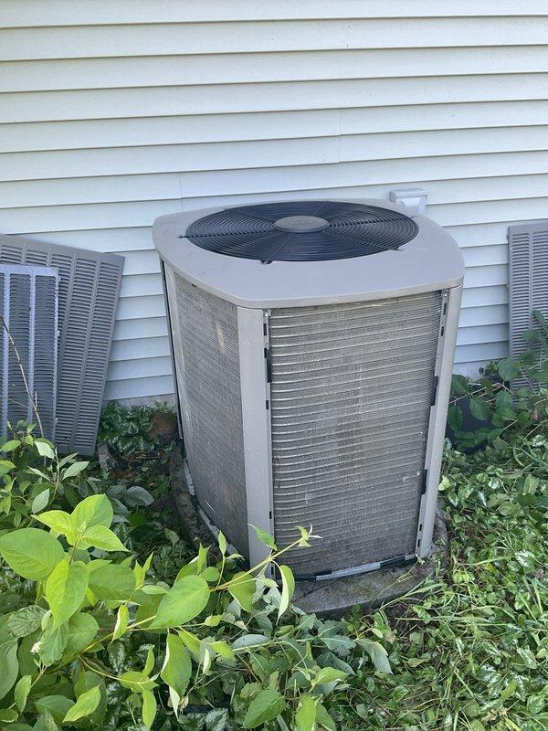 Responded to no cooling complaint on 4-year-old residential HVAC system unable to maintain setpoint below 79°F. Diagnosed refrigerant leak at evaporator coil requiring replacement. Found outdoor condenser coil completely blocked with debris and vegetation; performed coil cleaning to restore temporary airflow and heat transfer. System operational short-term but evaporator coil replacement needed immediately to prevent complete system failure.