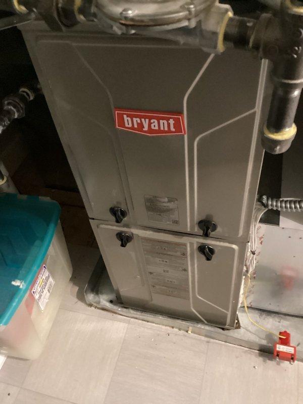 Responded to a no cooling complaint on a 3-year-old Bryant air conditioning system. Upon arrival, found the system was severely overcharged by over one pound of refrigerant due to improper service performed by an unqualified technician. Recovered the entire refrigerant charge from the system and performed nitrogen flow test through the low side, which showed no restrictions or blockages. Attempted to recharge the system to factory specifications using the recovered refrigerant, but observed erratic TXV operation indicating valve failure. 

During inspection, discovered the seasonal damper for the main floor zone was completely closed, restricting airflow. Opened the damper to proper position to restore air distribution. Due to the contaminated refrigerant from the improper previous service and the failed TXV, determined that complete refrigerant replacement with virgin R410A will be required along with TXV and filter drier replacement. System requires TXV replacement, new filter drier 