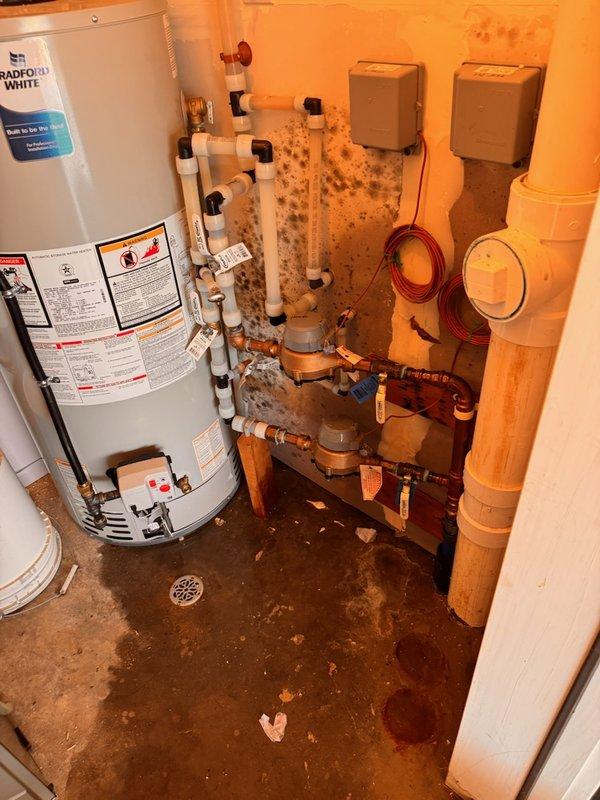 Responded to emergency water leak in mechanical room located at the main service line entry point. Upon arrival, city water had already been shut off due to active leak. Identified failed threaded ball valve on main house shut-off valve just before entry to residence. Replaced defective main shut-off ball valve and restored water service to property. During system pressurization testing, discovered secondary failure at irrigation system ball valve on same service line. Shut down water supply again and replaced failed irrigation ball valve to complete repairs. Both copper pipe connections were secured with proper fittings and tested for leaks. Visual inspection confirmed significant water damage to mechanical room walls and flooring from the leak. All plumbing connections verified operational before final restoration of water service to home and irrigation system.