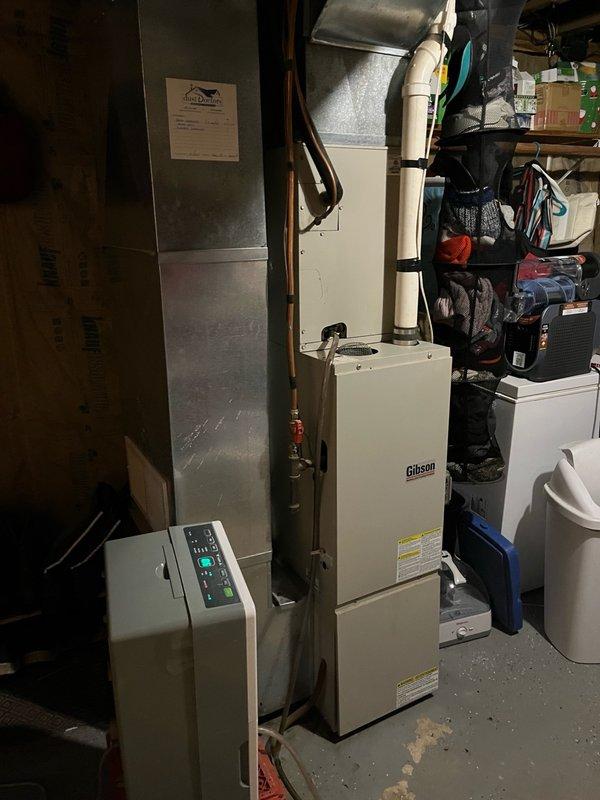 Responded to no cooling complaint on 18-year-old R-22 system with reported evaporator coil icing and poor airflow. Upon arrival, confirmed history of repeated freeze-ups and diminished airflow even after ice had melted. Performed system inspection and found primary evaporator coil heavily contaminated with dirt and debris, significantly restricting airflow. Secondary coil also showing accumulation but less severe. Blower assembly in acceptable operating condition. 

Inspected outdoor condensing unit and verified compressor and fan motor operation. Tested run capacitor on hermetic compressor circuit and found readings out of specification. Observed contactor with pitting on contact points indicating electrical wear. Explained to occupant that heavily soiled evaporator coil was root cause of both inadequate airflow and coil icing conditions. Advised that accurate refrigerant pressure analysis cannot be performed until airflow restriction is eliminated through proper coil cleaning.

Provi
