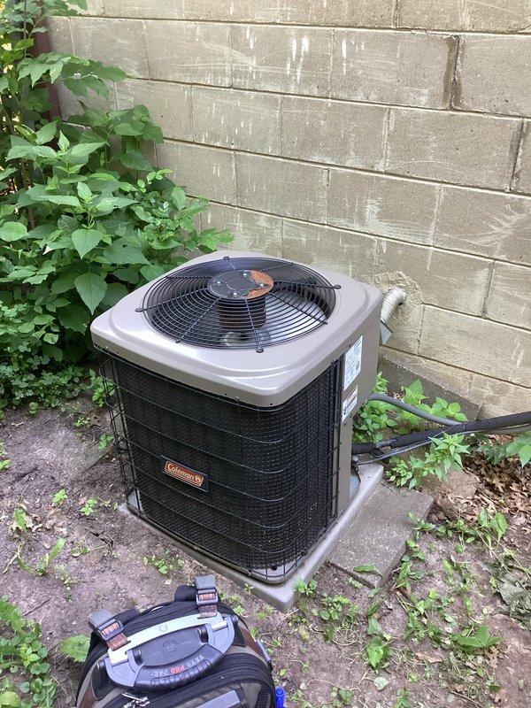 Provided second opinion on 15-year-old residential air conditioning system experiencing inadequate cooling performance and suboptimal airflow throughout home. Upon inspection, confirmed system is low on refrigerant charge, indicating potential refrigerant leak in system. Explained comprehensive leak search process and various repair scenarios that may result from leak detection. Discussed homeowner's concerns regarding insufficient airflow despite recent duct cleaning, inability to reach thermostat setpoint, and known insulation deficiencies in upper level causing excessive heat in primary bedroom. Explored alternative cooling solution options including mini-split installation for problem area. Documented system condition with exterior condenser unit photographs showing 15-year-old equipment with R-410A refrigerant, visible wiring configuration, and general age-related wear. Provided detailed repair options via email including leak search and recharge procedure. Discussed benefits of p