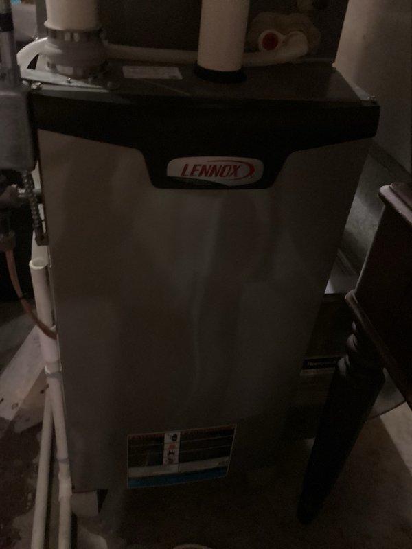 Responded to service call for water accumulation beneath tanked water heater. Upon inspection, identified pressure relief valve as source of active leak. Evaluated overall condition and age of water heater unit. Due to advanced age of equipment and cost-effectiveness considerations, recommended complete water heater replacement rather than isolated valve repair. Provided detailed replacement estimate to customer for review and approval before scheduling installation work.