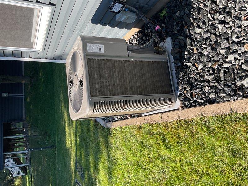 Performed comprehensive maintenance on a 2-year-old Lennox air conditioning system. Inspected MERV 13 filter and found significant gray debris buildup; advised homeowner to inspect regularly and replace every 3-6 months to maintain proper airflow. Cleaned outdoor condenser coil which was heavily impacted by cottonwood accumulation. Verified refrigerant charge against manufacturer specifications—system rated for 6° subcooling and currently operating at 6.8-7.0° subcooling, within acceptable range. System operating properly with no issues identified at this time.
