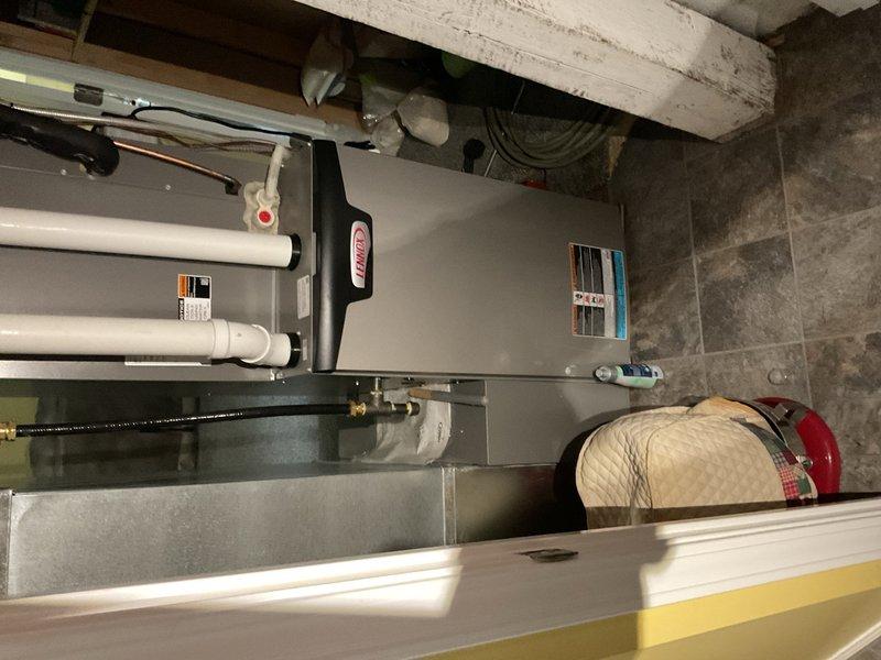 Responded to no cooling complaint on residential air conditioning unit less than 10 years old. Performed diagnostic testing by placing system in test mode and verified operation in both low and high cooling stages. Measured and confirmed discharge temperature, superheat, and subcooling readings were all within manufacturer specifications. Checked S40 thermostat control for fault codes and found no active faults or fault history in system memory. Enabled dealer lookup feature on Lennox dashboard for future diagnostic access if needed. System restored to full operational status with all cooling functions working properly.