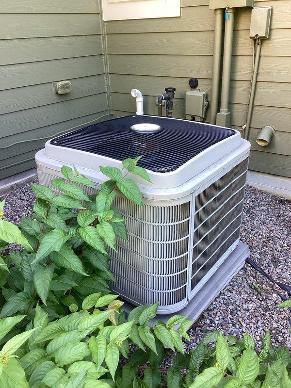 Responded to no-cool complaint on 14-year-old residential air conditioning system with icing condition on refrigerant lines. Upon arrival, found outdoor condenser unit operational with fan running but system unable to maintain temperature and displaying error message. Performed diagnostic evaluation including air filter inspection, which showed acceptable condition, then connected manifold gauges to measure refrigerant pressures. Testing revealed system was operating with insufficient refrigerant charge, causing evaporator coil to ice over and preventing proper heat transfer. Discussed repair options versus replacement given age of equipment and declining efficiency. Customer elected to proceed with full system replacement quote rather than recharging aging unit. Provided estimate for new HVAC system installation with expedited timeline to accommodate upcoming schedule requirements.