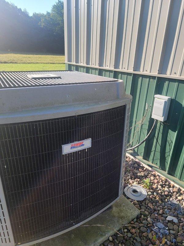 Responded to no-cool call on 22-year-old R22 central air system with reported buzzing noise and non-operational outdoor fan. Diagnosed and replaced failed capacitor on condenser unit, restoring system operation. Performed system verification including refrigerant pressure check (pressures within acceptable range), confirmed 18-degree temperature drop across evaporator coil, cleared condensate drain line, and verified condenser coil cleanliness. Advised homeowner that due to system age and R22 refrigerant phase-out, major repairs may not be cost-effective moving forward. Unit currently operational and cooling properly.