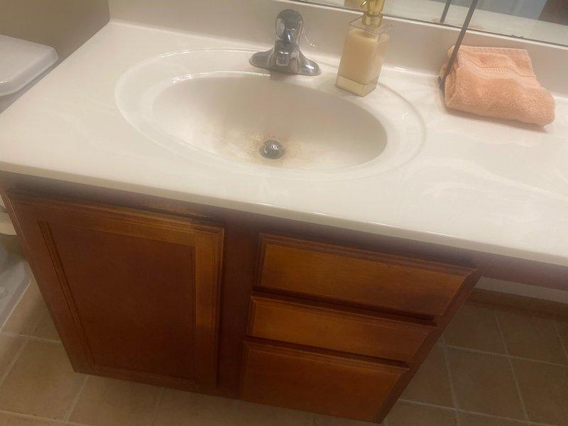 Conducted on-site assessment for multiple plumbing fixture upgrades throughout the residence. Evaluated existing lavatory faucet in bathroom vanity with chrome single-handle design for potential replacement. Inspected tub/shower trim assembly and cartridge condition in guest bathroom, documenting wear patterns and mineral buildup around valve components. Assessed main shower valve assembly for trim replacement or complete valve upgrade requirements. Photographed existing fixtures and documented current conditions to provide accurate estimates for cartridge replacement, trim upgrades, and installation of customer-supplied components.