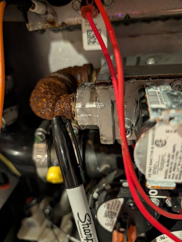 Responded to no cooling complaint on 3-year-old HVAC system experiencing reduced airflow and inability to maintain temperature. Upon inspection, discovered excessive condensation and moisture accumulation in furnace cabinet caused by humidifier bypass damper left open in summer mode. Cold supply air mixing with warm, humid outside air through open damper created condensation on ductwork and components, resulting in visible rust on metal pipes and moisture throughout electrical compartment. Verified system producing proper 20-degree temperature split, confirming cooling function operational. Closed humidifier bypass damper to winter position to prevent continued moisture infiltration. Instructed homeowner on proper seasonal damper operation and recommended removing top access door temporarily to allow trapped moisture to evaporate and cabinet to dry completely, preventing further corrosion of components.