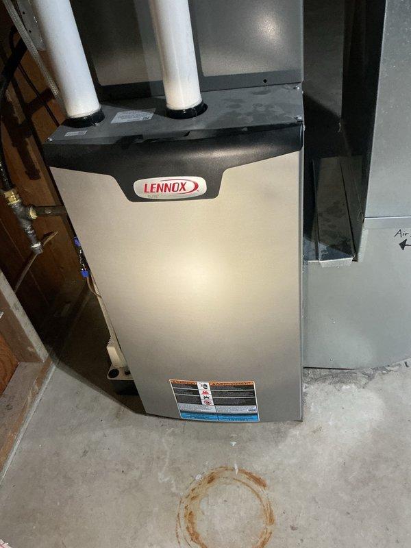 Responded to pre-sale home inspection findings regarding unsecured gas lines and corroded drainage fitting. Secured water heater gas line using two-hole straps and mounted furnace gas line with wall flange and split ring clamp. Cleaned minor surface rust from galvanized drain fitting joint. Gas lines were from previous installation completed three years prior and required proper mounting to meet code requirements.