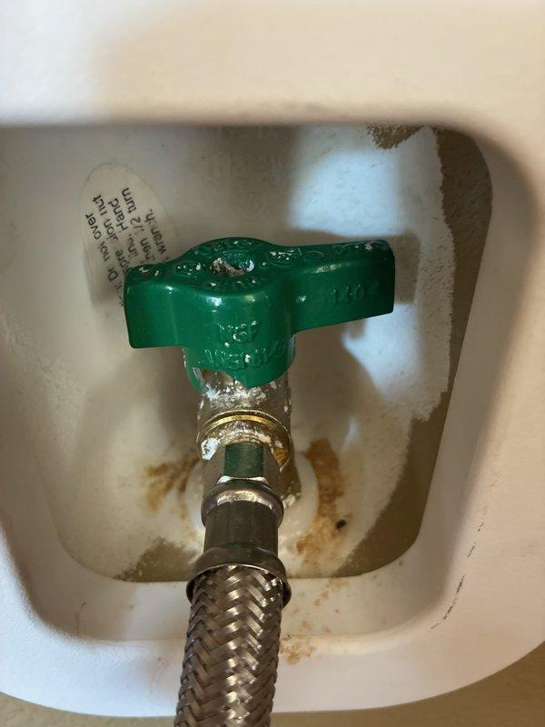 Responded to a service call for a refrigerator water supply issue where the existing icemaker shut-off valve handle had broken off, preventing the homeowner from controlling water flow to the appliance. Upon arrival, assessed the damaged compression-style valve assembly located in the wall-mounted outlet box and determined replacement was necessary for proper operation and safety.

Removed the failed shut-off valve and installed a new quarter-turn icemaker shut-off valve with green T-handle for easy operation. Connected the existing braided stainless steel flexible supply line to the new valve assembly, ensuring proper thread engagement and seal integrity at all connection points. Restored water supply to the refrigerator and conducted a thorough leak inspection of the valve body, handle assembly, and flex hose connections. Verified system was functioning correctly with no leaks detected and confirmed adequate water flow to the appliance.