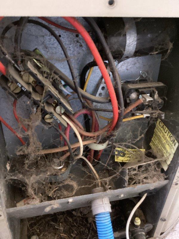 Completed comprehensive air conditioning maintenance visit on residential cooling system. Upon arrival, homeowner confirmed unit was operating properly with no reported concerns. Performed standard AC tune-up procedures including temperature split verification, which measured within acceptable parameters. Inspected outdoor condenser unit with protective cage guard on concrete pad—found equipment to be aged but functioning adequately with normal weathering. Examined indoor air handler components, noting significant dust and debris accumulation on blower assembly, electrical connections, and interior compartment surfaces. System continues to provide adequate cooling performance despite age of equipment.