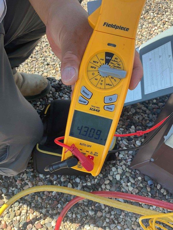 Performed comprehensive AC tune-up on rooftop unit after obtaining roof access key from front desk. Identified and replaced dirty air filter and failing capacitor during inspection. Verified system operation with electrical testing using digital meter, confirming proper capacitance readings and ensuring unit returned to optimal performance.