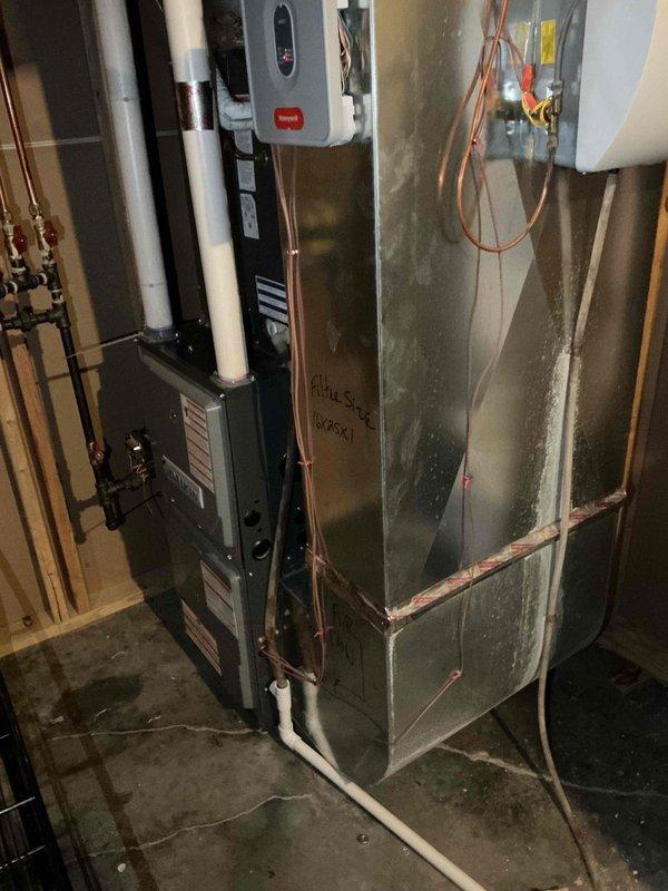 Responded to no cooling complaint on residential air conditioning system. Upon arrival, performed system diagnostics and discovered heavily plugged condenser coil restricting airflow. Thoroughly cleaned and flushed condenser coil to restore proper heat exchange capacity.

After coil cleaning, system continued to exhibit inadequate cooling performance. Connected manifold gauges to assess refrigerant charge on fixed orifice metering device system. Diagnostics revealed abnormally low superheat readings accompanied by audible compressor slugging, indicating system overcharge condition. Recovered 1.5 pounds of excess refrigerant from system to restore proper charge levels.

Cycled system and verified improved cooling performance. Advised occupants to monitor system operation over next several hours to allow any residual liquid refrigerant to stabilize throughout the circuit, and to report if cooling issues persist.