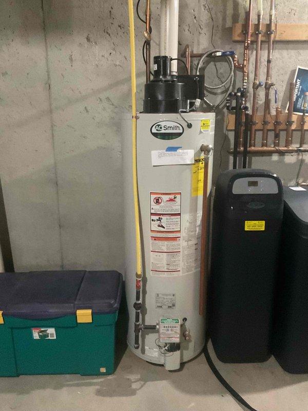 Responded to urgent water leak complaint at furnace system. Upon inspection, determined water intrusion was occurring through the outdoor fresh air intake vent located near exterior landscaping. Identified that water from plant watering and sprinkler system was entering directly through the intake pipe, causing moisture accumulation in the furnace compartment. Advised homeowner to redirect watering practices away from the intake vent to prevent future water intrusion and potential damage to internal furnace components.