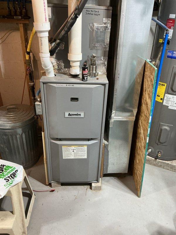 Responded to no cooling complaint on 12-year-old Comfortmaker air conditioning system with condenser clicking but not running. Diagnosed failed dual run capacitor (35+5 MFD 440/370VAC). Replaced capacitor with ProSelect PSIRC2R355A unit and performed complete system run test. Verified proper refrigerant charge levels, inspected all electrical components, and confirmed 18-degree temperature split across evaporator coil. System restored to normal operation.