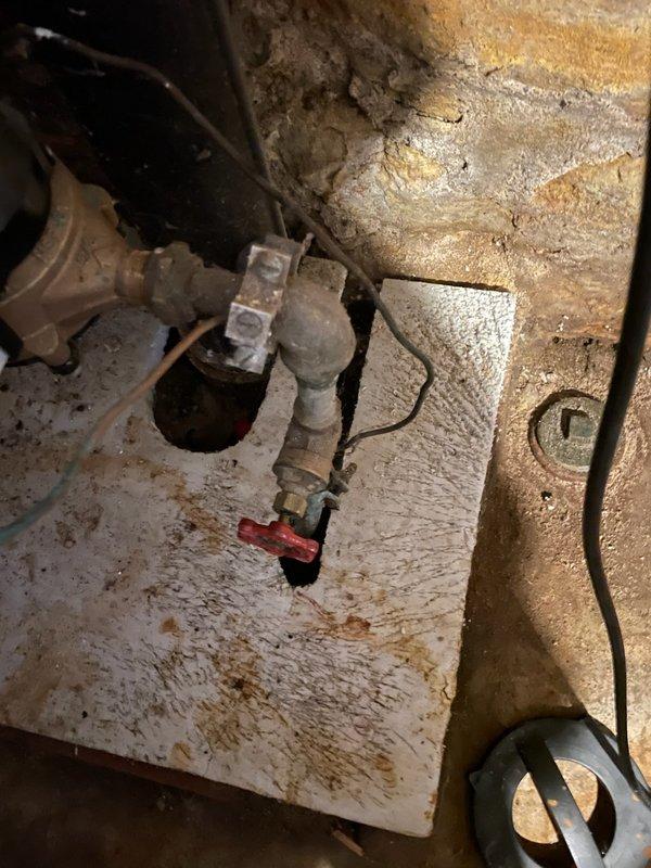 Responded to service call for leaking shut-off valve located before the water meter. Upon inspection, confirmed active leak at valve assembly and identified moisture damage on surrounding wooden panel. Evaluated valve condition and determined replacement necessary to prevent further water loss and property damage. Prepared comprehensive estimate for valve replacement work, which will require coordination with municipal water department for street-side shut-off during installation. Documented existing conditions with photographs and forwarded estimate to customer for approval before scheduling.