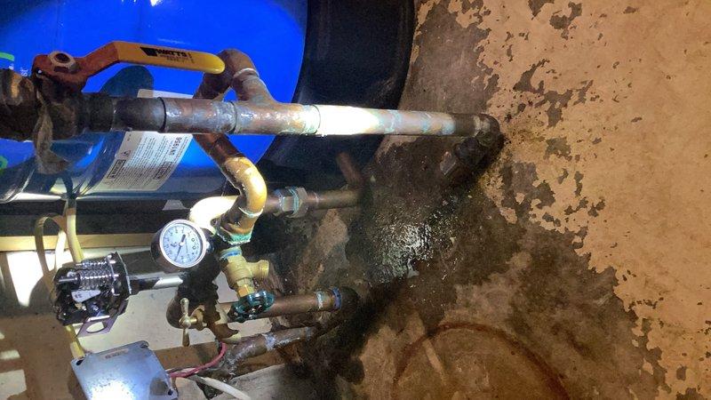 Responded to a no water pressure issue at the well system. Upon arrival, diagnosed a faulty pressure switch causing intermittent water supply that would shut off after 15 minutes of operation and resume after 5-10 minutes. Replaced the defective pressure switch with a new unit, restoring proper system operation and consistent water pressure throughout the home. Documented existing water condition concerns and coordinated follow-up service for acid water treatment to address water quality issues affecting the plumbing system.