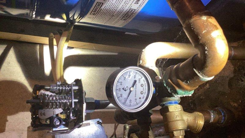 Responded to a no water pressure issue at the well system. Upon arrival, diagnosed a faulty pressure switch causing intermittent water supply that would shut off after 15 minutes of operation and resume after 5-10 minutes. Replaced the defective pressure switch with a new unit, restoring proper system operation and consistent water pressure throughout the home. Documented existing water condition concerns and coordinated follow-up service for acid water treatment to address water quality issues affecting the plumbing system.