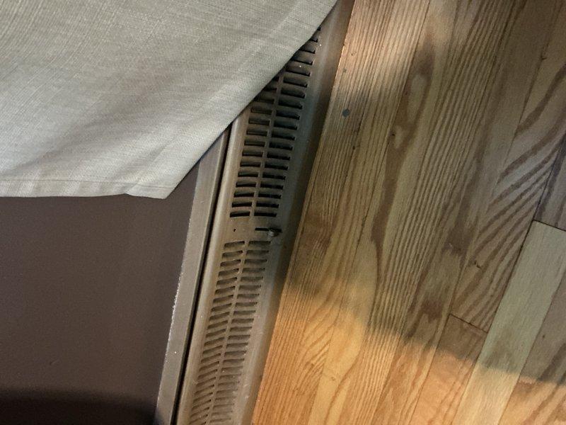 Responded to no airflow complaint affecting four upstairs bedrooms. Diagnosed inadequate blower speed setting when system operated in fan-only mode—adjusted blower speed from low to mid-high setting, which restored airflow to three of four bedrooms. Investigated master bedroom supply vent with zero airflow and discovered supply vent was incorrectly connected to return ductwork rather than supply trunk line, confirmed by observing spider webs being drawn inward instead of expelled outward. Unable to trace ductwork routing from basement due to concealed chase with no access points. Located and repaired two disconnected duct sections in basement using foil tape to restore proper connections. Documented misrouted master bedroom ductwork requiring replacement to establish proper supply air path—recommended scheduling estimate for ductwork rerouting and installation of access panel for future serviceability.