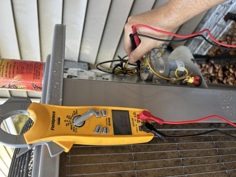 Performed comprehensive AC tune-up on 2-year-old system with dual-zone configuration. Verified proper operation of both thermostats and zone dampers throughout testing cycle. Replaced air filter, cleared condensate drain line, and closed humidifier damper for seasonal operation. Confirmed excellent temperature drop across ECM blower motor system.

Addressed customer concern regarding unit noise by removing wasp nest from outdoor disconnect, then power-washed condenser coil to restore optimal airflow. Vibration noise ceased after cleaning. Leveled outdoor unit to correct sagging on one corner, improving stability and reducing potential strain on refrigerant lines. Performed electrical diagnostics using clamp meter to verify all components operating within manufacturer specifications. System running efficiently with no deficiencies noted.