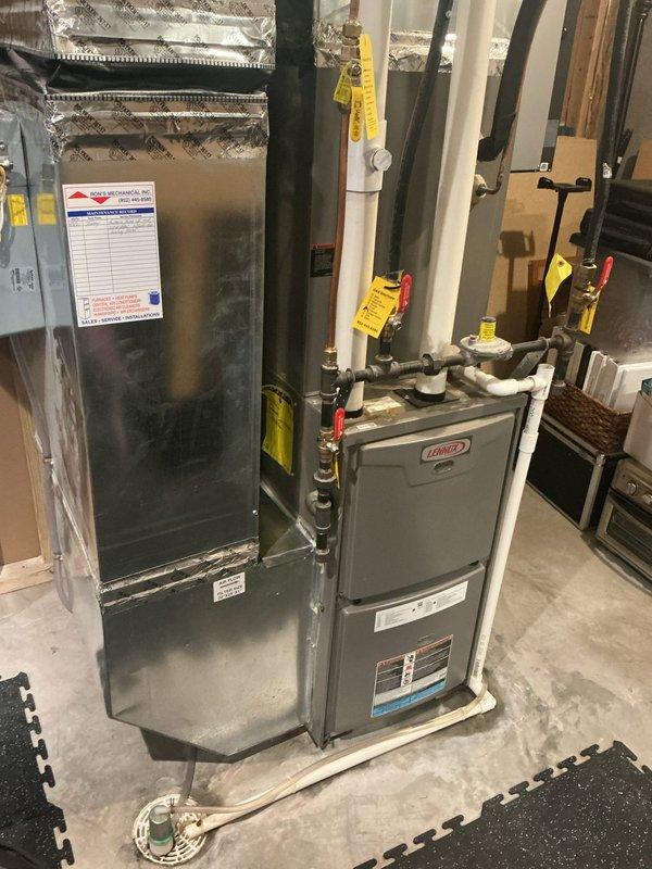 Responded to service call for 11-year-old Lennox AC system unable to maintain desired temperature of 73 degrees, only reaching 78 degrees. Upon inspection, diagnosed system as low on obsolete refrigerant, causing intermittent indoor coil freezing that resulted in inconsistent cooling performance and restricted airflow. Documented equipment condition with photos of outdoor condenser unit and indoor air handler/furnace system. Provided customer with repair options and recommended system replacement due to age and obsolete refrigerant type. Scheduled follow-up estimate appointment for new AC installation.