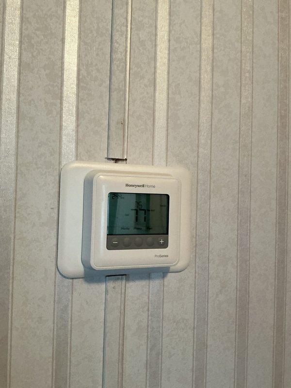 Responded to complaint of unit running constantly without adequate cooling on 1-year-old Lennox system. Upon inspection, determined indoor blower was operating continuously. Identified thermostat fan switch had been inadvertently set to "ON" position instead of "AUTO" mode. Adjusted Honeywell Home ProSeries thermostat fan setting from continuous operation to AUTO mode, which resolved the issue immediately. Verified system now cycles properly with blower activating only during heating and cooling calls. Provided customer education on proper thermostat operation and function of fan control settings to prevent future occurrences. No mechanical defects found; unit operating within normal parameters.