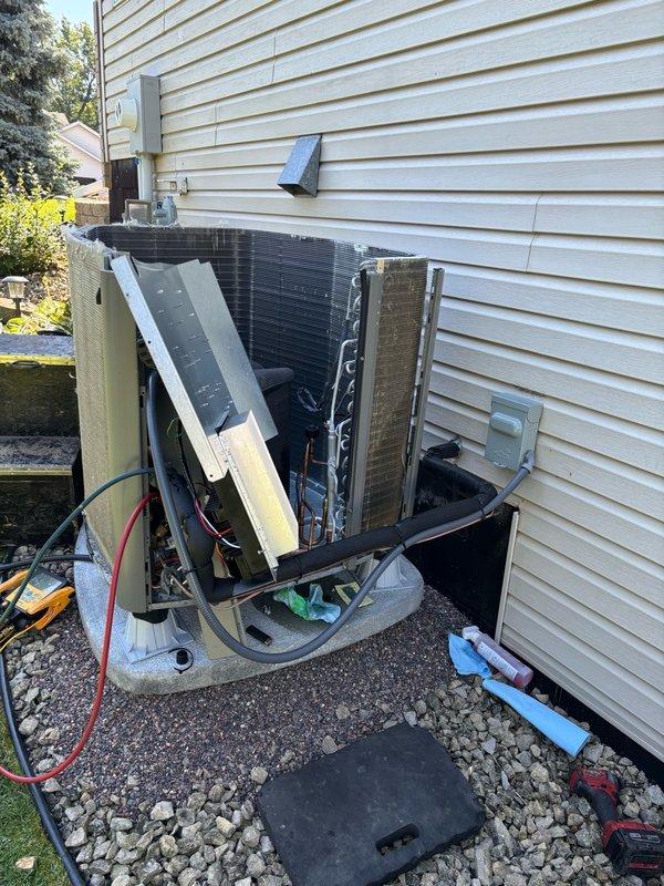 Performed warranty repair on SL25 condenser unit for factory refrigerant leak at joint connection. Disassembled outer casing to access internal components, located leak point, and completed repair using manifold gauges to verify system integrity and proper refrigerant levels.