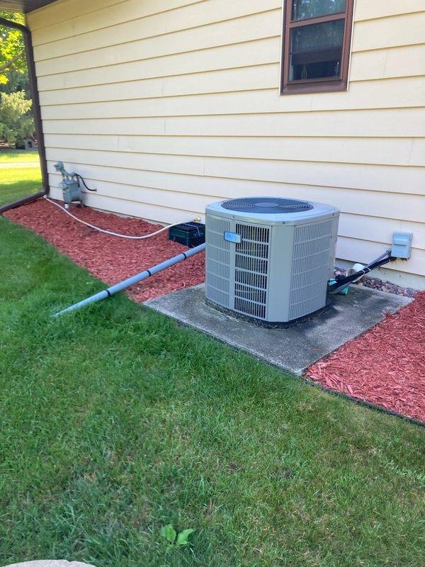 Responded to no cooling complaint on 10-year-old American Standard Silver series air conditioning unit. Upon arrival, found indoor blower operating and thermostat calling for cooling, but outdoor condensing unit failed to start. Diagnosed dual-run capacitor completely failed, reading 0 microfarads on both compressor and fan motor terminals. Replaced defective capacitor and verified system operation, achieving proper 20-degree temperature split across evaporator coil. Advised customer that capacitor failure often indicates pending condenser fan motor failure and recommended obtaining estimate for motor replacement as preventative measure to avoid future breakdown.