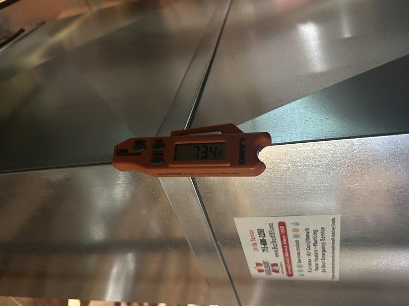 Responded to no cooling complaint on 9-year-old AC system with frozen evaporator coil and blower motor cycling on and off intermittently. Diagnosed faulty control board by isolating cooling speed tap and testing voltage output, which failed to produce consistent 120V. Bypassed defective board by connecting cooling speed wire directly to line voltage, confirming blower motor and compressor operation restored normal cooling function. Recommended control board replacement under warranty before heating season to restore proper heating speed functionality. System operational at time of departure with temporary bypass in place.