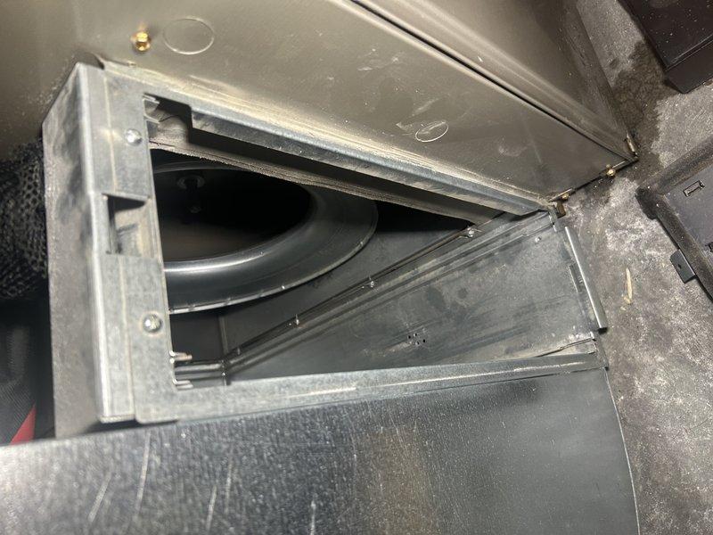 Responded to no cooling complaint on 9-year-old AC system with frozen evaporator coil and blower motor cycling on and off intermittently. Diagnosed faulty control board by isolating cooling speed tap and testing voltage output, which failed to produce consistent 120V. Bypassed defective board by connecting cooling speed wire directly to line voltage, confirming blower motor and compressor operation restored normal cooling function. Recommended control board replacement under warranty before heating season to restore proper heating speed functionality. System operational at time of departure with temporary bypass in place.