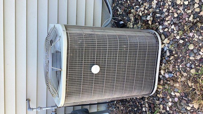 Responded to no cooling complaint on 20+ year old residential air conditioning system. Upon inspection, discovered compressor not operating due to loose wire connection at capacitor. Reattached wire to capacitor terminal and secured connection to prevent future detachment. Performed comprehensive system check including evaporator coil, blower assembly, air filter, thermostat operation, condenser unit, capacitor, contactor, compressor function, and refrigerant charge levels. Verified system returned to normal cooling operation with all components functioning properly.