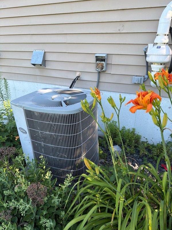 Responded to no cooling call on 21-year-old R22 central air conditioning system. Upon inspection, diagnosed failed dual run capacitor on condenser unit with fan motor exhibiting significant mechanical resistance and stiffness. Replaced failed dual capacitor and condenser fan motor to restore cooling operation. During service visit, also inspected furnace and identified cracked heat exchanger requiring immediate attention for safety concerns. Tagged furnace and recommended complete heat exchanger replacement along with comfort advisor consultation for system evaluation given age of equipment.