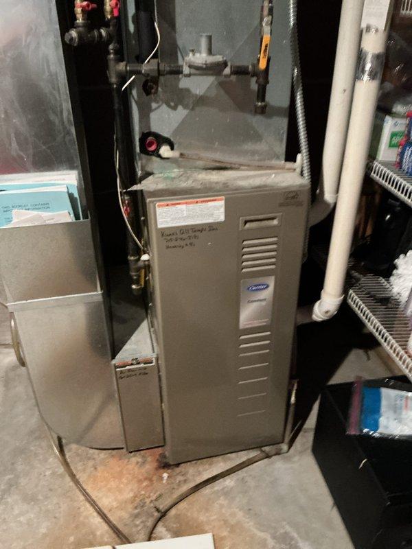 Responded to no cooling call on 21-year-old R22 central air conditioning system. Upon inspection, diagnosed failed dual run capacitor on condenser unit with fan motor exhibiting significant mechanical resistance and stiffness. Replaced failed dual capacitor and condenser fan motor to restore cooling operation. During service visit, also inspected furnace and identified cracked heat exchanger requiring immediate attention for safety concerns. Tagged furnace and recommended complete heat exchanger replacement along with comfort advisor consultation for system evaluation given age of equipment.