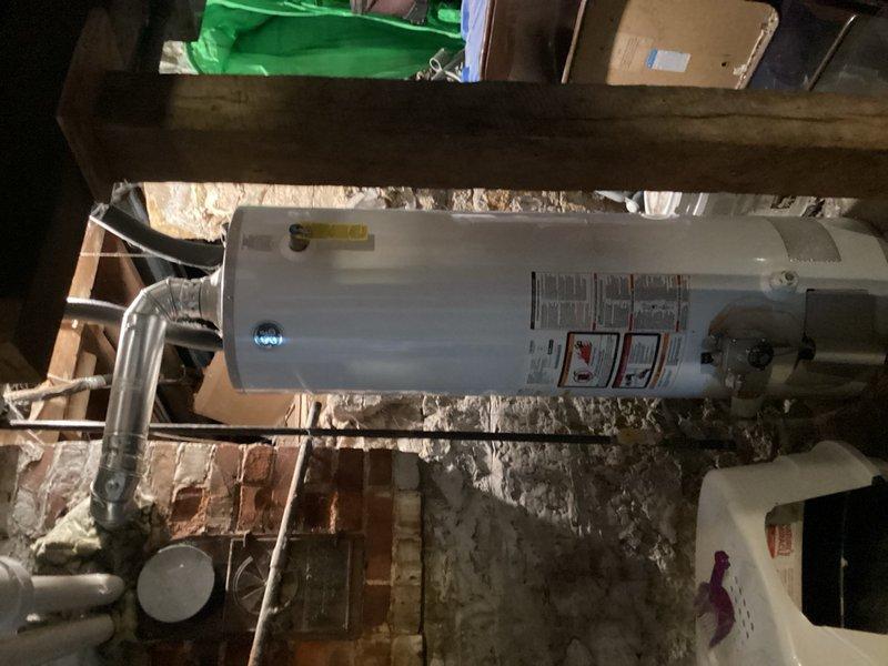 Responded to no cooling complaint and found Lennox Pulse furnace blower motor not operating. Removed blockage from blower motor that had caused overheating; capacitor tested within specifications. Successfully restored blower operation, though motor replacement is recommended due to thermal damage. Diagnosed non-operational condensate pump and provided replacement estimate. Inspected outdoor condenser unit and confirmed coil is clean and clear of obstructions. System restored to operational status with cooling functionality confirmed at time of departure.