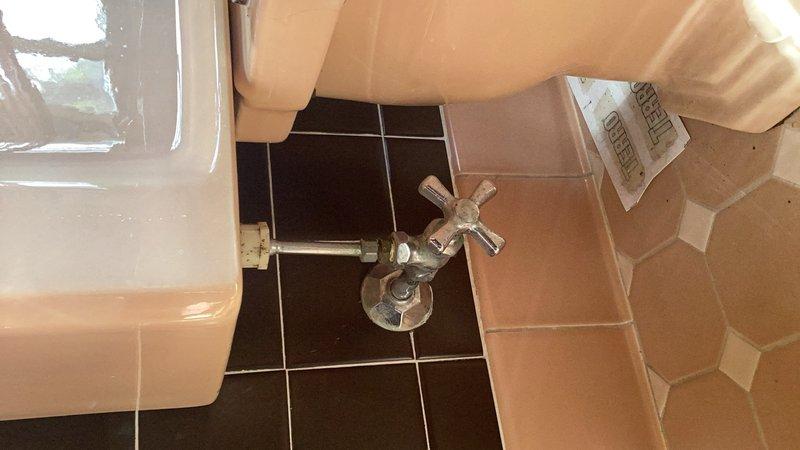 Completed comprehensive plumbing inspection of residential property. Tested water pressure at multiple fixtures including kitchen faucet and bathroom installations, recording elevated static pressure of 105 psi, which exceeds the recommended maximum of 80 psi for residential plumbing systems. Inspected kitchen sink area with chrome faucet and side sprayer, confirming proper fixture operation. Evaluated bathroom plumbing including toilet, pedestal sink, and floor-mounted shut-off valves with supply lines in good working condition.

Conducted water quality assessment and identified severe hard water conditions affecting the property. Explained to homeowner the potential long-term effects of excessive water pressure on plumbing fixtures, appliances, and water heater, including premature failure and increased risk of leaks. Provided detailed estimate for installation of pressure reducing valve (PRV) to bring system pressure within safe operating range of 40-60 psi.

Discussed benefits of w