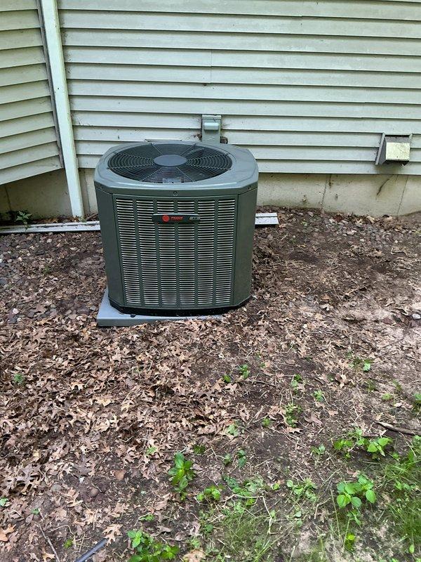 Responded to callback for loud noise from Trane air conditioning system following recent tune-up. Upon arrival, unit was operating quietly with no audible abnormalities present. Performed comprehensive inspection of indoor air handler and outdoor condenser unit, measuring amperage draw and low-voltage readings throughout the system. All electrical measurements were within normal operating parameters except for compressor capacitor readings, which showed out-of-specification values. Diagnosed faulty capacitor as the probable cause of intermittent noise complaint. Replaced defective capacitor with new unit, restoring proper electrical values and eliminating potential noise source. System tested and verified operational.