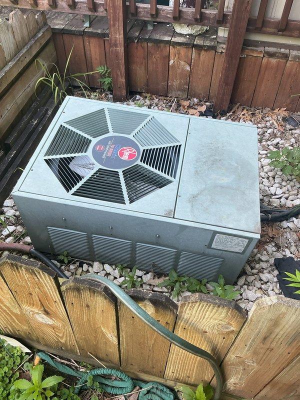 Responded to no-cool condition on 24-year-old residential central air conditioning system containing R22 refrigerant. Upon inspection, found condenser fan motor had failed and existing run capacitor was incorrect rating for the motor, which likely contributed to premature failure. Also identified failing contactor. Replaced condenser fan motor with proper OEM equivalent unit and installed correctly-rated run capacitor to manufacturer specifications. System restored to operational status with condenser fan running properly and unit cooling effectively.