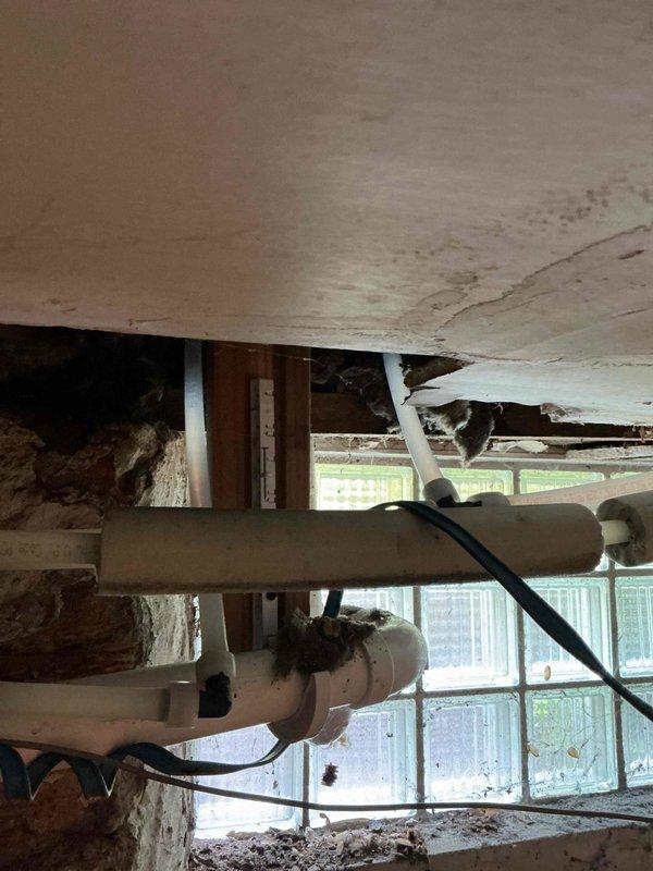 Responded to emergency bathtub leak caused by failed supply line and defective faucet assembly. Removed deteriorated supply line and malfunctioning faucet fixtures. Installed new braided flexible supply line with proper mounting hardware and replaced faucet components to restore full water control and eliminate active leak. System tested and verified operational with no leaks detected.