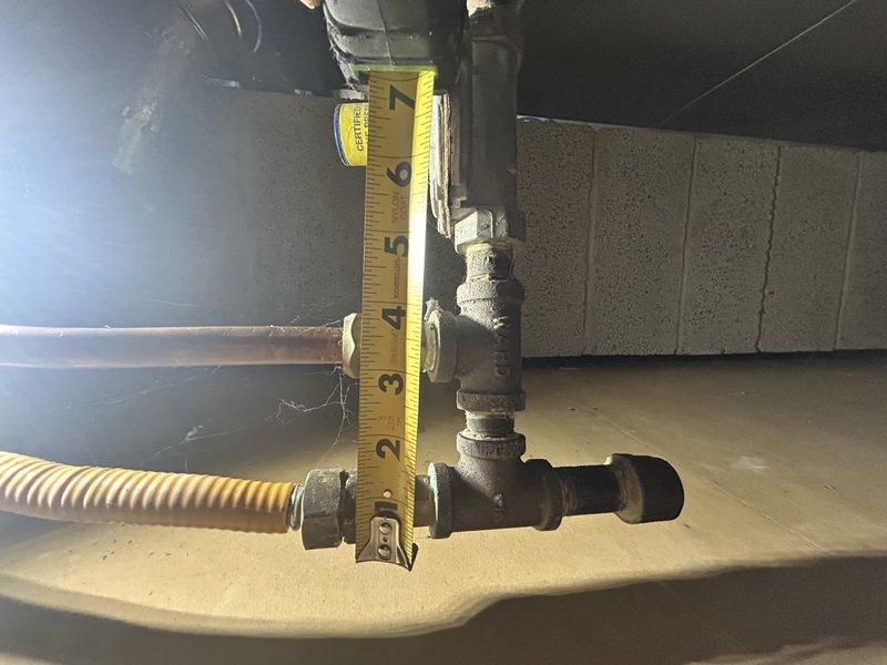 Responded to emergency gas leak at exterior fitting serving fireplace and pool heater. Upon arrival, utility company had shut off main gas meter to residence due to leak on unvalved line. Verified leak at flare fitting which was hand-tight with compromised flare connection. Attempted tightening but flare remained defective. Due to spatial constraints at original location, installed new section of gas-tight line routed through fence to allow proper connection access. Completed installation, pressurized system, and performed leak check verification on all connections. Restored gas service to residence and relit water heater pilot light and one fireplace pilot successfully. Second fireplace pilot would not light, which homeowner confirmed is a pre-existing intermittent issue with that unit. Verified pool heater operation and confirmed all gas appliances functioning properly with no active leaks detected.