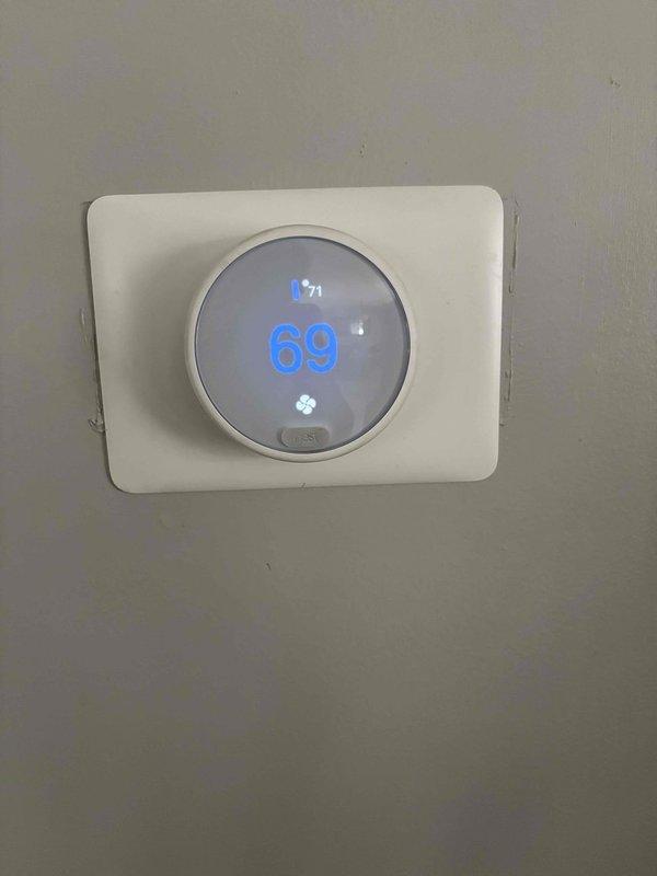 Responded to cooling efficiency complaint on recently installed system unable to maintain setpoint of 69°F, with indoor temperature reaching 74°F and unit running continuously. Homeowner reported basement vents closed but main floor struggling to reach desired temperature, an ongoing issue since installation. Performed comprehensive system diagnostics including thermostat operation, air handler inspection, temperature split measurement, air filter condition, blower speed verification, outdoor unit assessment, and refrigerant level check. All components found operating within normal parameters. Adjusted blower speed to lower setting and added refrigerant to system to optimize cooling performance. Advised homeowner to monitor system performance and contact for follow-up if cooling efficiency does not improve.