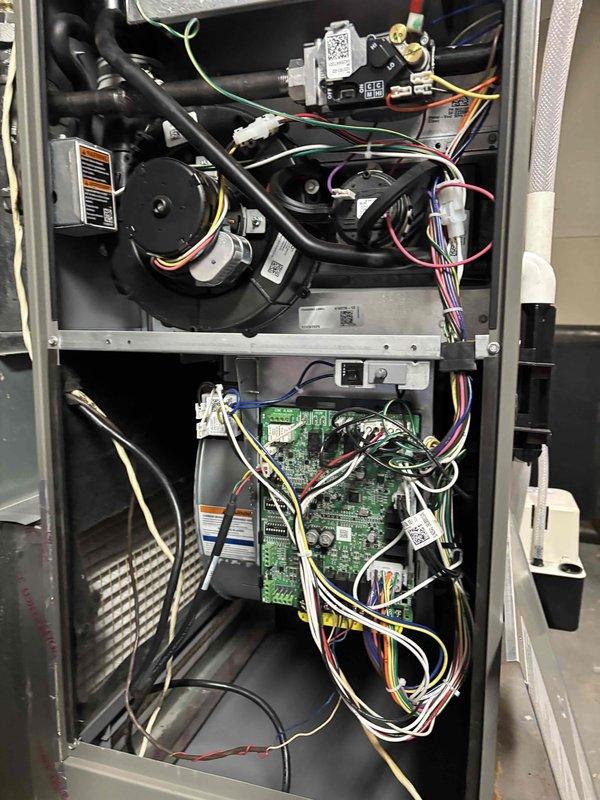 Responded to cooling efficiency complaint on recently installed system unable to maintain setpoint of 69°F, with indoor temperature reaching 74°F and unit running continuously. Homeowner reported basement vents closed but main floor struggling to reach desired temperature, an ongoing issue since installation. Performed comprehensive system diagnostics including thermostat operation, air handler inspection, temperature split measurement, air filter condition, blower speed verification, outdoor unit assessment, and refrigerant level check. All components found operating within normal parameters. Adjusted blower speed to lower setting and added refrigerant to system to optimize cooling performance. Advised homeowner to monitor system performance and contact for follow-up if cooling efficiency does not improve.