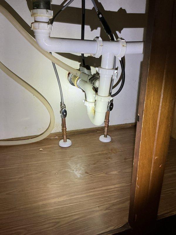Responded to service call for malfunctioning kitchen faucet in residential home. Upon inspection, determined existing faucet required replacement due to failure. Removed old kitchen faucet assembly and installed new chrome pull-down single-handle faucet unit on double-basin stainless steel sink. Installed new angle stops on water supply lines to ensure proper shut-off capability and code compliance. Tested new faucet installation for proper operation, water flow, and verified no leaks at connections or supply lines. All plumbing connections secured and functional upon completion.