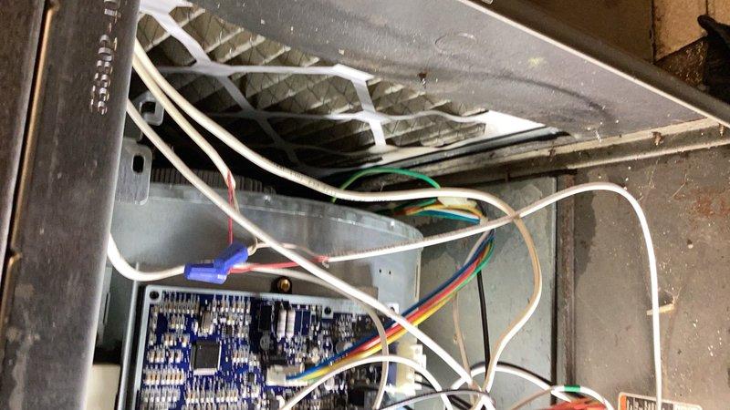 Responded to no-cool complaint with system freezing to compressor on 10+ year old R-22 unit. Upon arrival, unit was off and thawing from previous freeze-up incident. Performed comprehensive diagnostic of indoor and outdoor components.

Inspected indoor air handler and found condensate drain line blocked. Cleared obstruction and verified proper drainage. Checked blower operation and discovered airflow issue - blower was operating at reduced speed during cooling mode due to thermostat configuration set to low stage. Adjusted blower speed setting to 325 CFM to correct airflow deficiency. Verified TXV sensing bulb properly attached and secured.

Evaluated outdoor condenser unit. Tested contactor, run capacitor, and compressor - all components operating within normal parameters. Checked refrigerant charge and identified two issues: mild restriction present in refrigerant circuit and system slightly overcharged. Unable to perform refrigerant adjustment or restriction repair as unit contains 