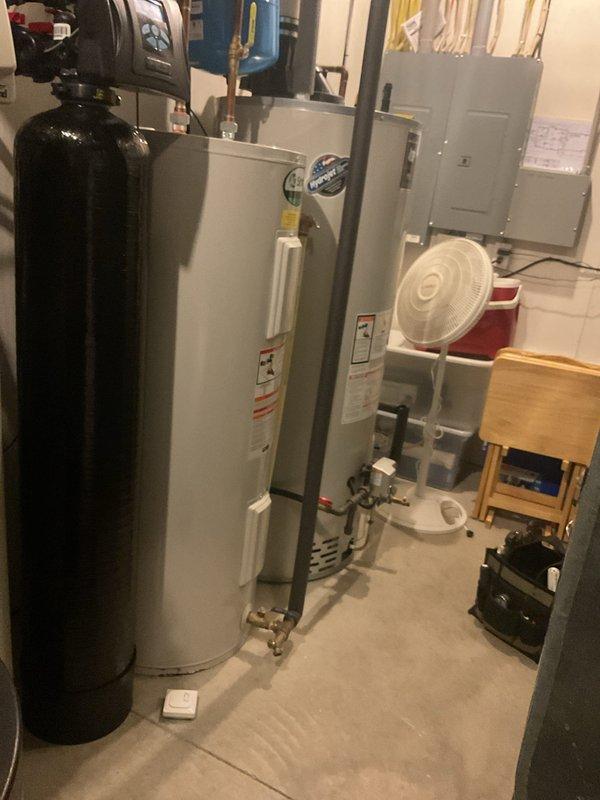Completed annual maintenance tune-up on 12-year-old geothermal heat pump system and gas furnace. Serviced geothermal unit including flushing condensate lines, adding water to ground loop, inspecting capacitor and contactor (both operational), and verifying proper temperature differential across system. Inspected gas furnace and identified excessive condensation accumulation from intake manifold collecting inside cabinet; advised homeowner that permanent resolution would require plugging intake line. All other furnace components inspected and operating within normal parameters. Both heating and cooling systems functioning properly upon completion of comprehensive tune-up service.