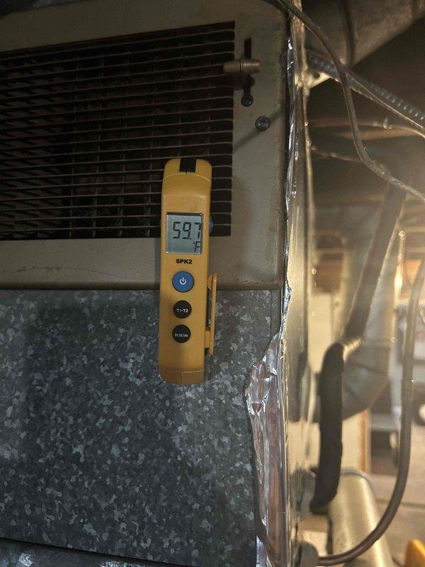 Responded to no cooling call on 10+ year old air conditioning system with breaker tripping issue. Upon arrival, found outdoor condenser unit experiencing repeated electrical trips preventing operation, resulting in warm air from supply vents. Diagnosed failed capacitor as root cause of breaker trips. Replaced defective capacitor and restored unit to normal operation. Verified refrigerant charge levels were within manufacturer specifications. Measured supply air temperature at 59°F, confirming proper cooling performance. Given the age of the system and recent failure, recommended customer consider replacement options to avoid future breakdowns and improve efficiency.