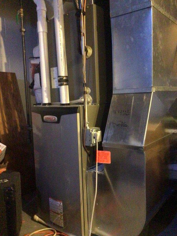 Completed annual AC tune-up on 1-year-old Lennox system. Performed comprehensive maintenance including washing outdoor condenser unit, testing all electrical components which measured within manufacturer specifications, and replacing air filter. System operating properly with 20-degree temperature drop across coil confirmed after service.