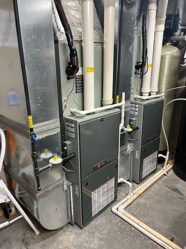 Completed commercial furnace inspection on four heating units for state compliance documentation. Performed comprehensive inspection of all electrical components, flame sensors, condensate lines, filters, blowers, evaporator coils, burners, gas pressures, and motor amp draws across all units.

**Furnace #1:** All electrical components within specifications. Cleaned flame sensor and verified condensate drainage. Filters, blower, secondary heat exchanger, and evaporator coil all clear. Burners clean with proper gas pressures confirmed. Heat exchanger inspection revealed typical Trane cracking at burner inlets along riveting edges—early stage deterioration noted. Recommended annual inspections moving forward to monitor progression. Inducer motor previously replaced in 2024.

**Furnace #2:** All electrical components within specifications. Cleaned flame sensor and verified clear condensate lines with proper drainage. Burners free of debris. Filter and blower clean, secondary heat exchanger