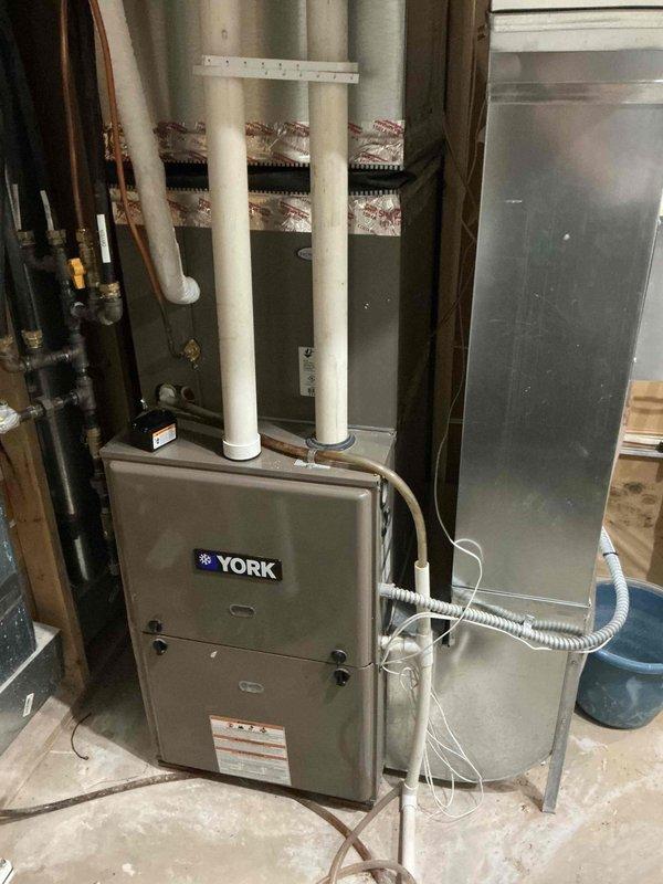 Completed comprehensive tune-up maintenance on both furnace and air conditioning systems. Inspected furnace components including filter, blower assembly, and flame sensor—all found to be clean and in good condition. Verified condensate drainage system functioning properly. Identified minor leak at collector box seal and provided estimate for future repair. Tested gas pressure and confirmed proper settings. System startup demonstrated proper operation with 50° temperature rise across heat exchanger.

Proceeded to air conditioning unit and performed electrical component inspection. Tested capacitor reading 45/5 microfarads—within specification. Rinsed outdoor coil, which was already in excellent clean condition. Started system and verified proper operation with 23° temperature split across evaporator coil. All electrical connections secure and refrigerant charge adequate based on operational parameters. Advised monitoring collector box leak for future service needs. Both systems operatin