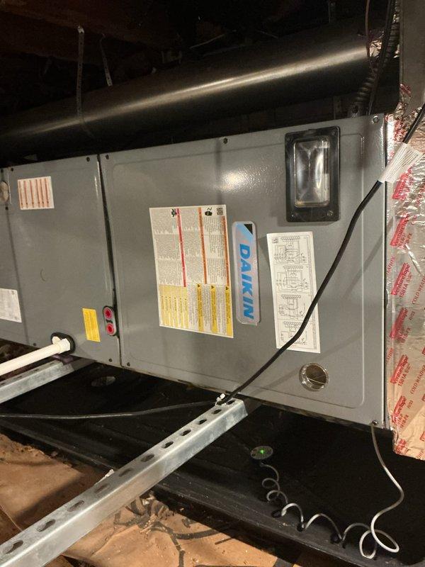 Completed annual cooling preventative maintenance visit on Daikin heat pump system with side discharge configuration. Performed comprehensive AC tune-up on outdoor heat pump unit and indoor air handler located in attic space. Conducted full system inspection, verified refrigerant charge, checked electrical connections, tested thermostat operation, and confirmed proper airflow. All components operating within manufacturer specifications with no deficiencies noted.