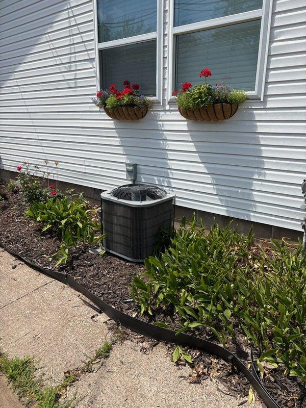 Responded to complaint of air conditioning system running continuously without adequate cooling. Inspected 2017 Carrier air conditioning unit matched with 2003 Nordyne furnace. Used FLIR thermal imaging to verify cooling performance, measuring 56°F air temperature leaving evaporator with 80°F indoor ambient temperature, confirming normal temperature split and proper refrigerant charge. Inspected outdoor condenser unit and performed light coil rinse; coil showed minimal dirt accumulation. Discovered heavily restricted air filter with visible deflection, indicating significant airflow reduction. Replaced air filter and demonstrated restriction to homeowner. Discussed thermostat usage patterns, which revealed system being turned off during portions of the day, resulting in extended recovery run times when reactivated. System operating within normal parameters with no mechanical deficiencies identified. Extended runtime attributed to combination of restricted airflow from dirty filter and 